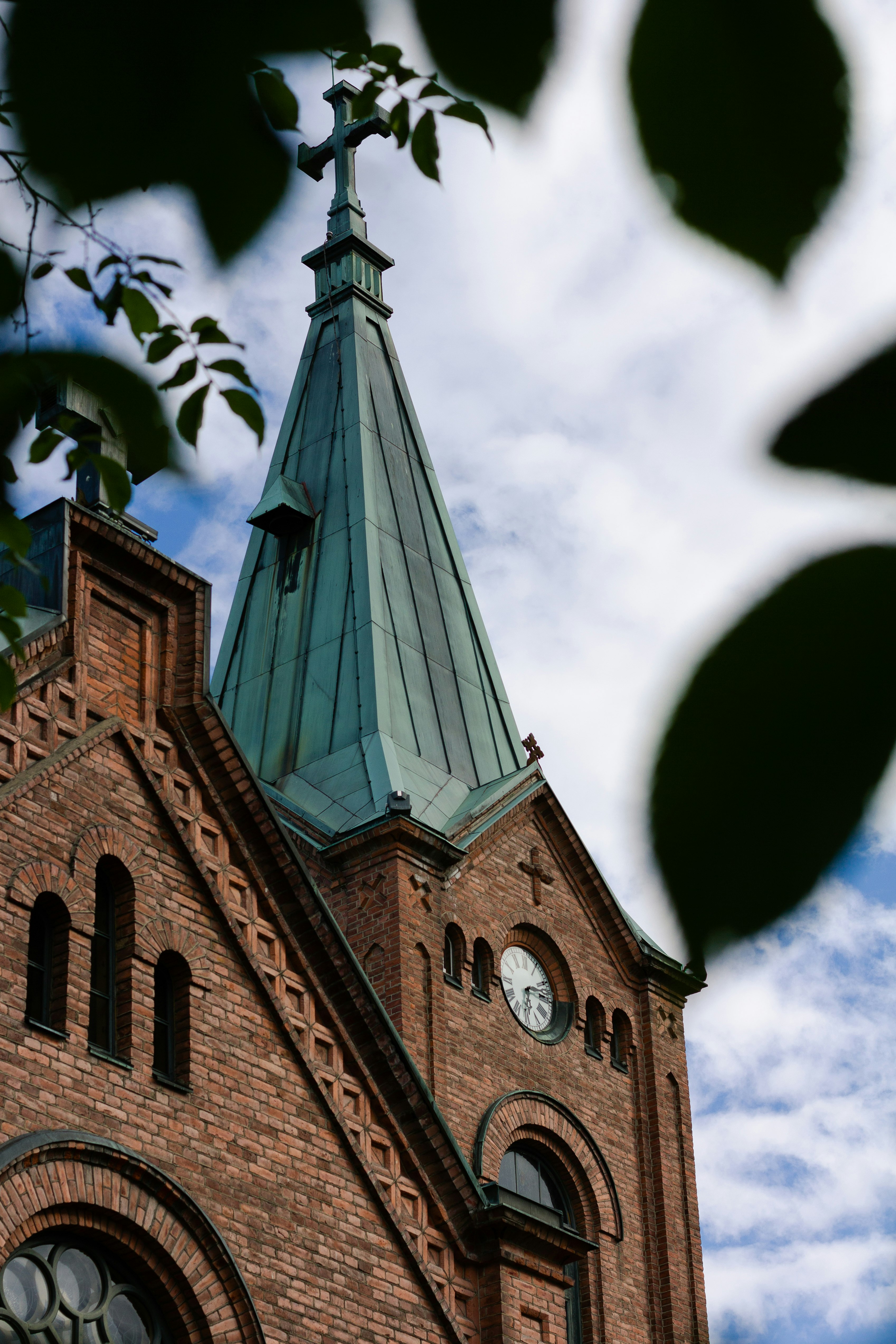 brown brick building under cloudy sky